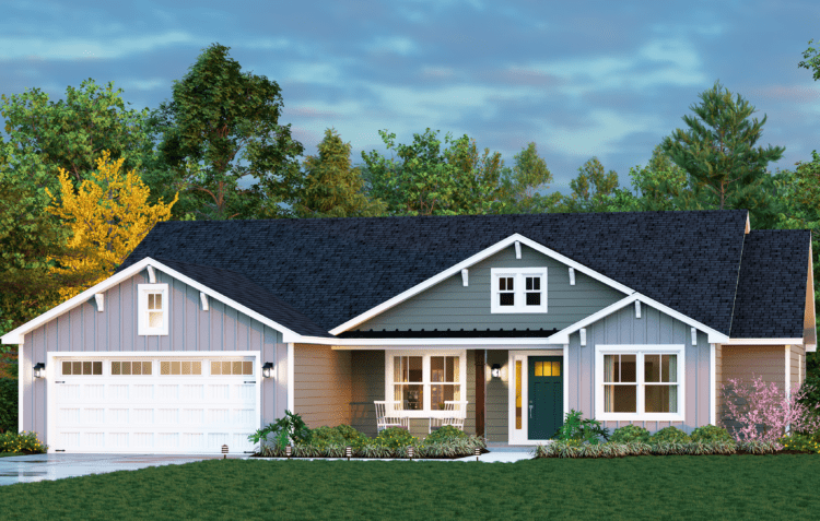 A modern, single-story house with gray siding, white trim, a dark roof, and a double garage—perfect for those seeking custom homes in North Central Florida. The front yard features green grass, shrubs, blooming flowers, and trees under a blue sky.